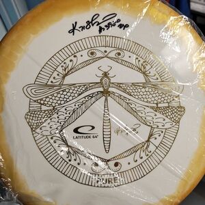 Latitude 64 Gold Disc with Dragonfly Design